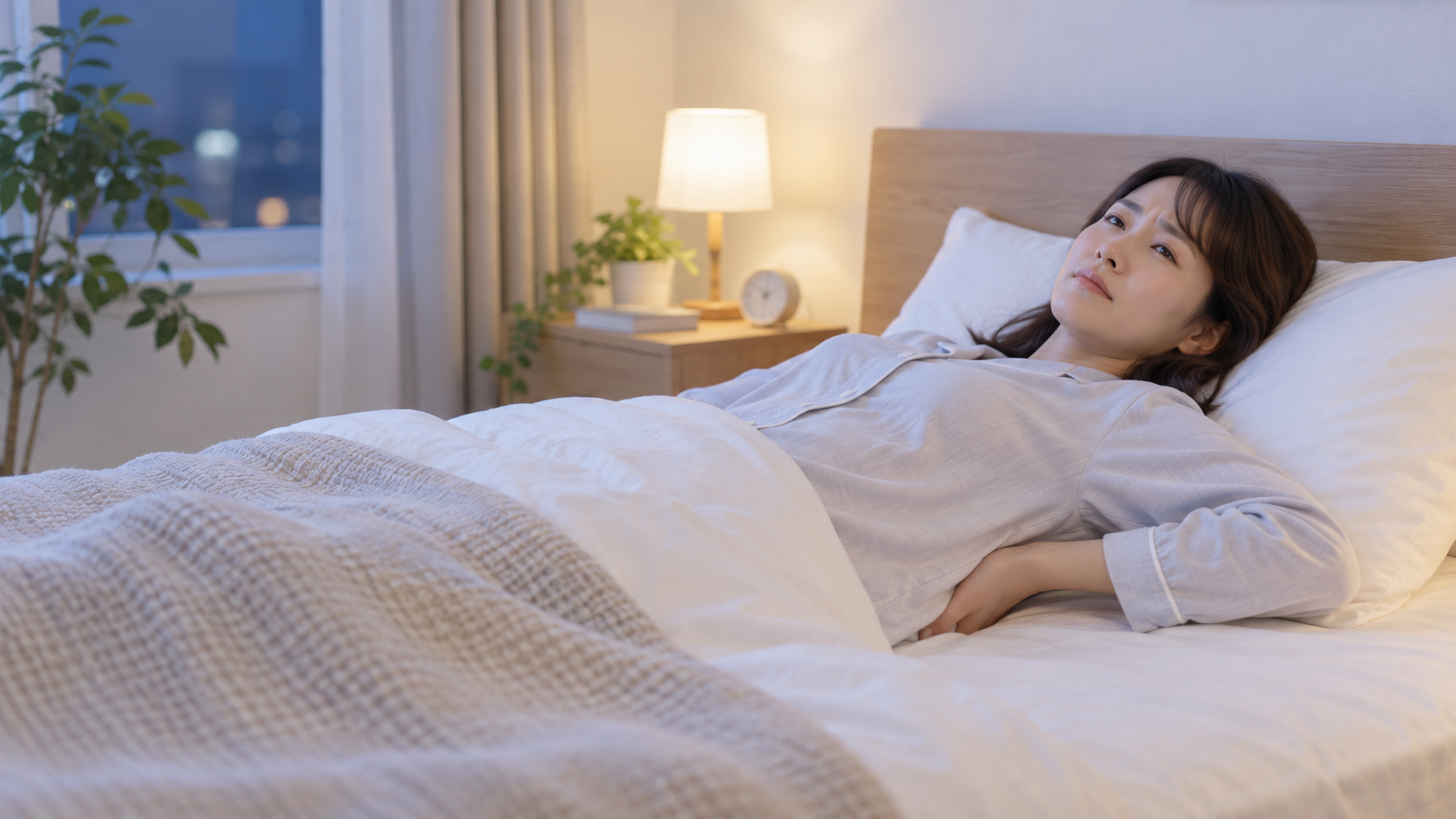 仰向けで寝ると腰が痛い女性